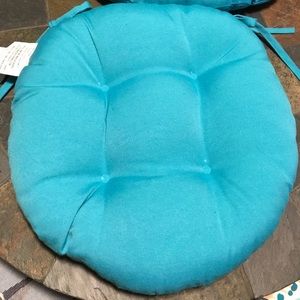 4  16” turquoise round chair cushions.  New